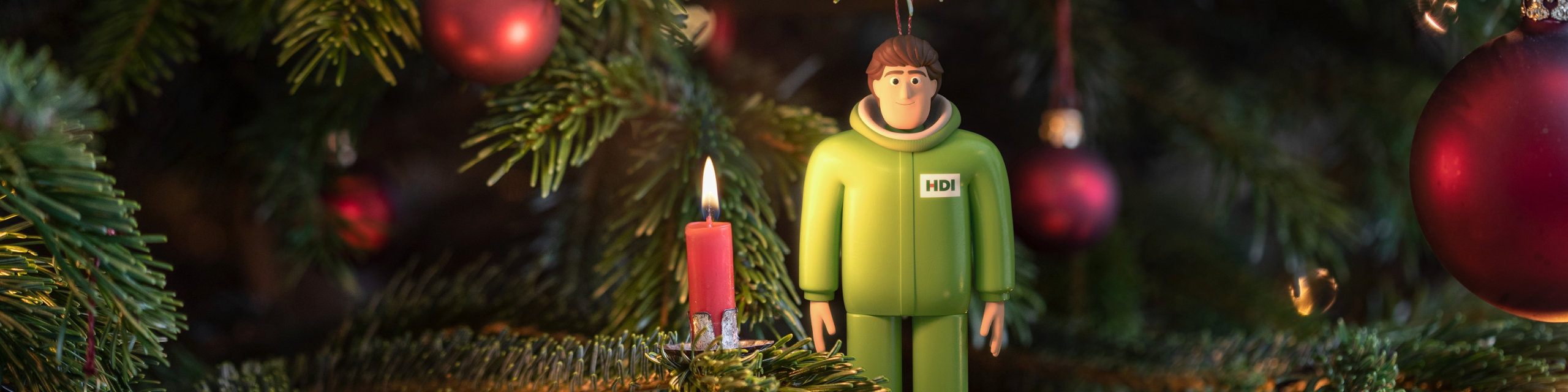 HDI Brand Character mit brennender Kerze